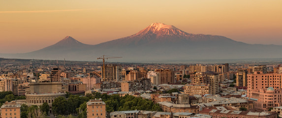 City skyline of Yerevan at sunrise, with Mt Ararat in background - obrazy, fototapety, plakaty