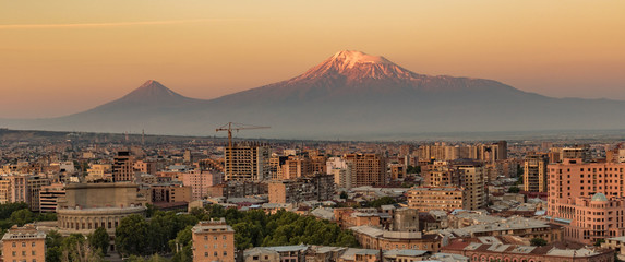 City skyline of Yerevan at sunrise, with Mt Ararat in background