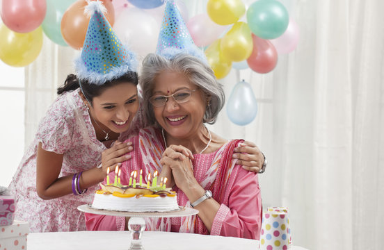 Woman celebrating birthday with granddaughter