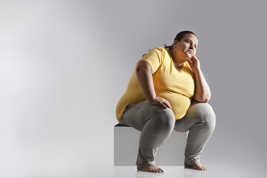 Obese woman thinking