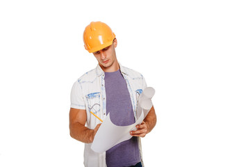 Construction engineer looking at the blueprint. Isolated on white.
