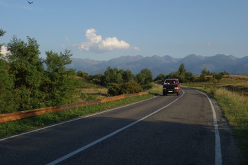 Road in Transylvania, Romania with Fagaras mountains in the background