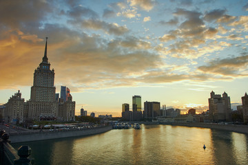 Fototapeta premium Cityscape at sunset and office buildings at background
