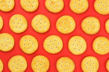 Flat lay crackers pattern on red background