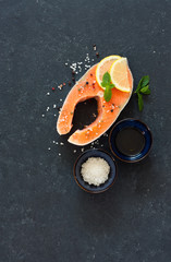 Raw salmon fillet with peppers and sea salt