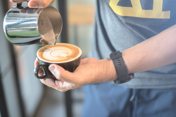 coffee latte art in coffee shop vintage color tone