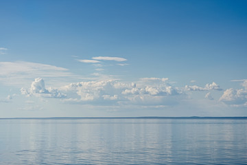 Sea on blue sky background