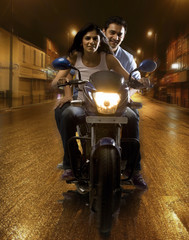 Fototapeta na wymiar Couple on a motorbike 