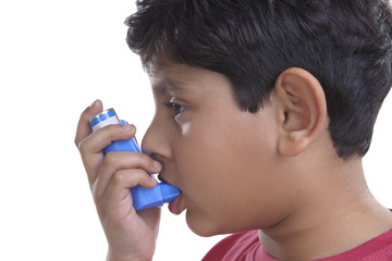 Little boy using an inhaler