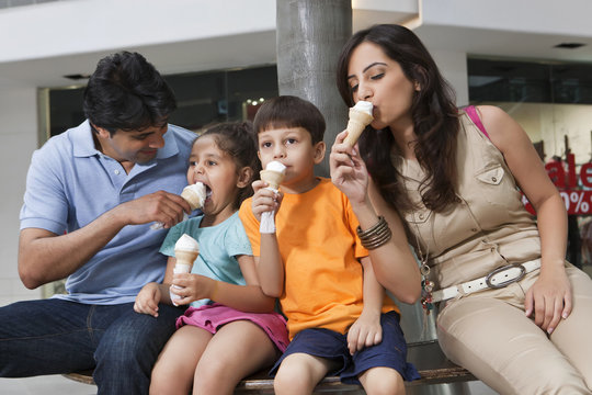 Family having great time together while eating ice cream 
