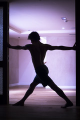 Fototapeta na wymiar Man yoga teacher practice