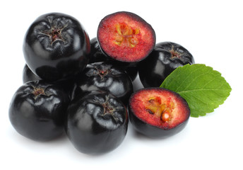 Chokeberry with leaf isolated on white background. Black aronia.