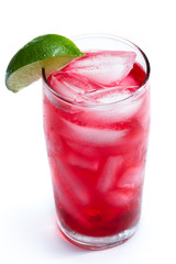 red cocktail with a lime