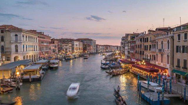 Venice city skyline day to night sunset timelapse from Rialto Bridge and Venice Grand Canal, Venice, Italy, 4K Time lapse