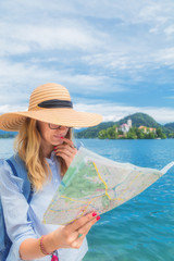 Fototapeta premium Tourist with a map enjoying the summertime.