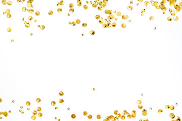 Mock up frame with space for text made of golden confetti tinsel on white background. Flat lay, top...