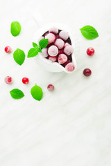 Cold cranberry in sauce pan with mint