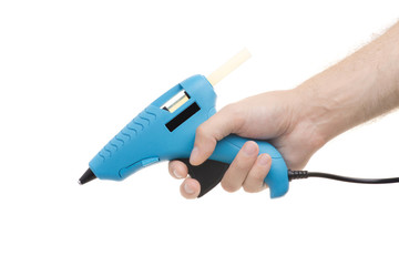 Glue gun in the man's hand