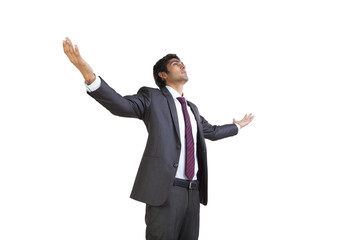 Business executive enjoying with arms outstretched