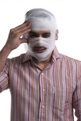 Man with a bandaged head 