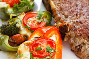 Grilled meat steak with vegetables and cheese