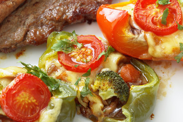 roasted meat steak with vegetables and cheese