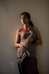 Woman holding a saxophone 