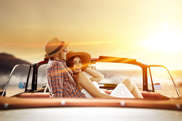 two lovers in retro car 