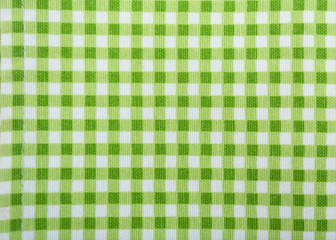 Green checkered cloth as background, closeup