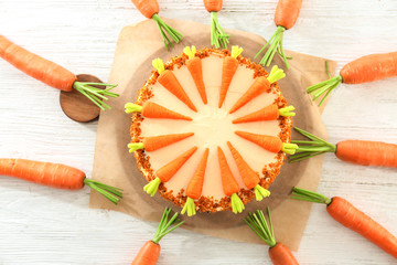 Delicious carrot cake on wooden table