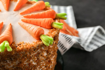 Delicious carrot cake on table, closeup