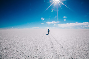 Boy walking in Uyuni salt flats