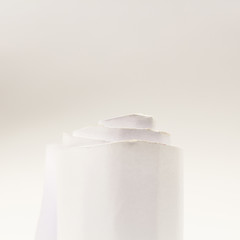 Colorful paper shapes with paper background
