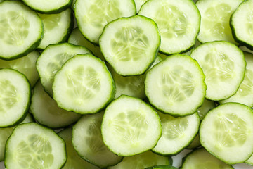 Fresh cucumber slices as background