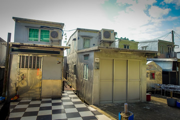 Metallic buildings used as home in old fishermen village Tai O with rustic houses in Hong Kong