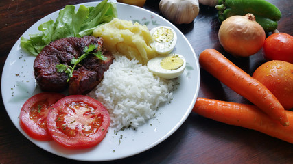 Lunch with fresh vegetables on wooden table top view