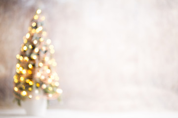 Defocused christmas tree silhouette with blurred lights.