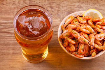Glass of beer and shrimps. Beer and prawns
