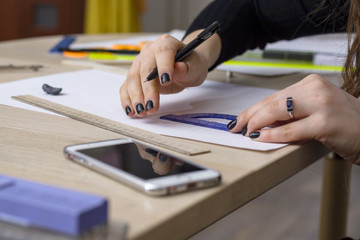 The girl student is preparing a plan. Architectural University