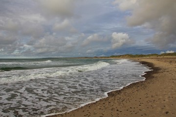 Waves at the beach of Klitmoller. Summer scene at the west coast of Denmark.