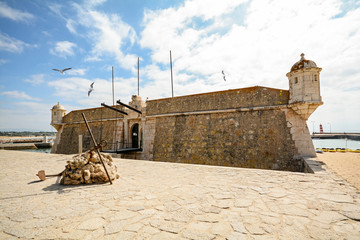 View to entrance gate of fortress Forte da Ponta da Bandeira in Lagos, Algarve Portugal 