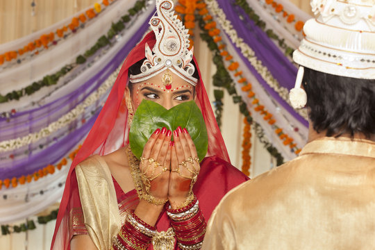 Bengali Bride Hiding Her Face From The Groom 