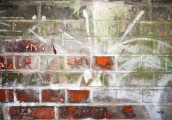 wall scratched and etched into inside tunnel