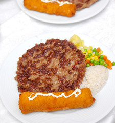 burger and chicken roll on a plate