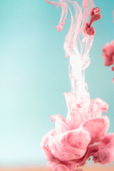 Pink ink in water, artistic shot, abstract background