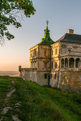 Fototapeta na wymiar Medieval Pidhirtsi Castle in sunset summer light, Pidhirtsi village, Lviv region, Ukraine
