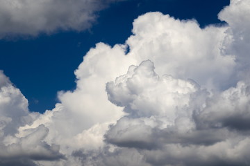 Naklejka na ściany i meble Clouds against the blue sky background