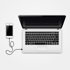 Mobile phone connected to laptop © fad82
