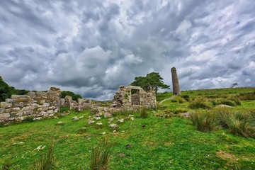 Old Tin Mine, old ruined granite buildings set on Dartmoor.. Dartmoor National Park is vast moorland in the county of Devon, England UK.