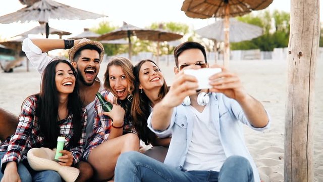 Group of happy young people enjoying summer vacation
